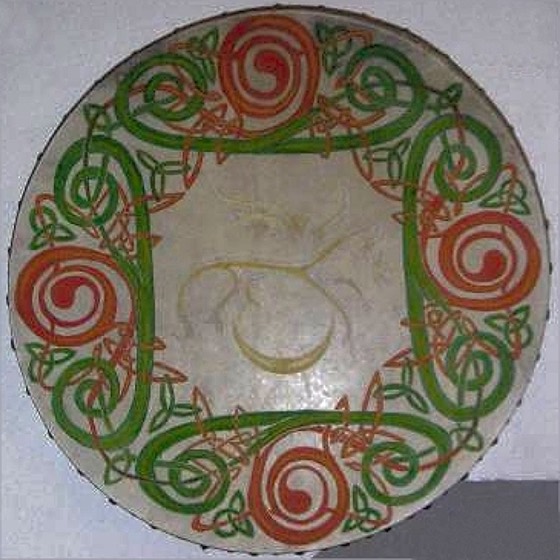 Shamanic drum painted with Celtic knotwork spirals and a central horned figure