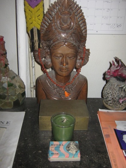 Carved bust of the goddess Tripura on a shrine
